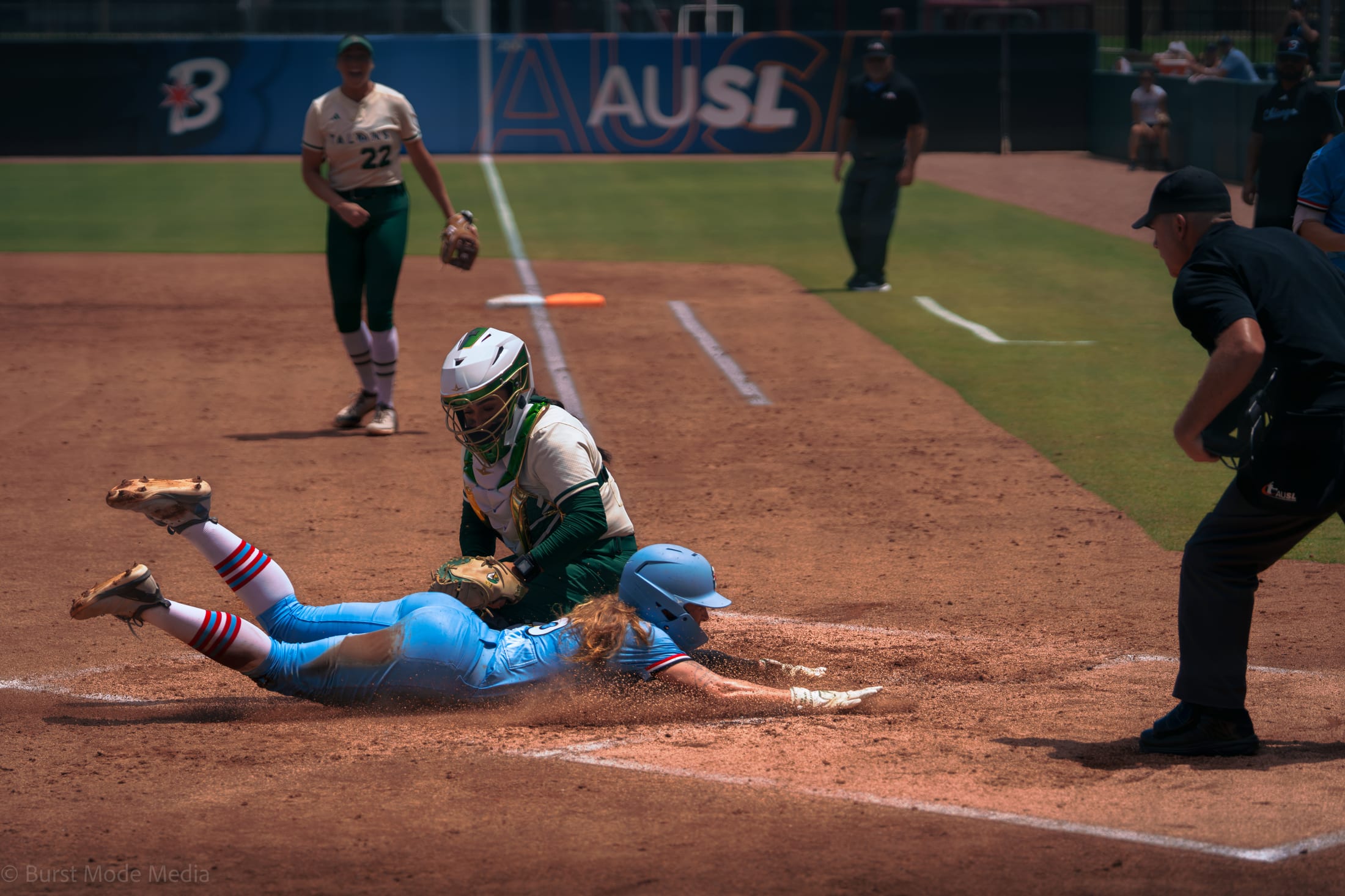 Bella Dayton slides home as Sharlize Palacios waits on the throw in the third inning.