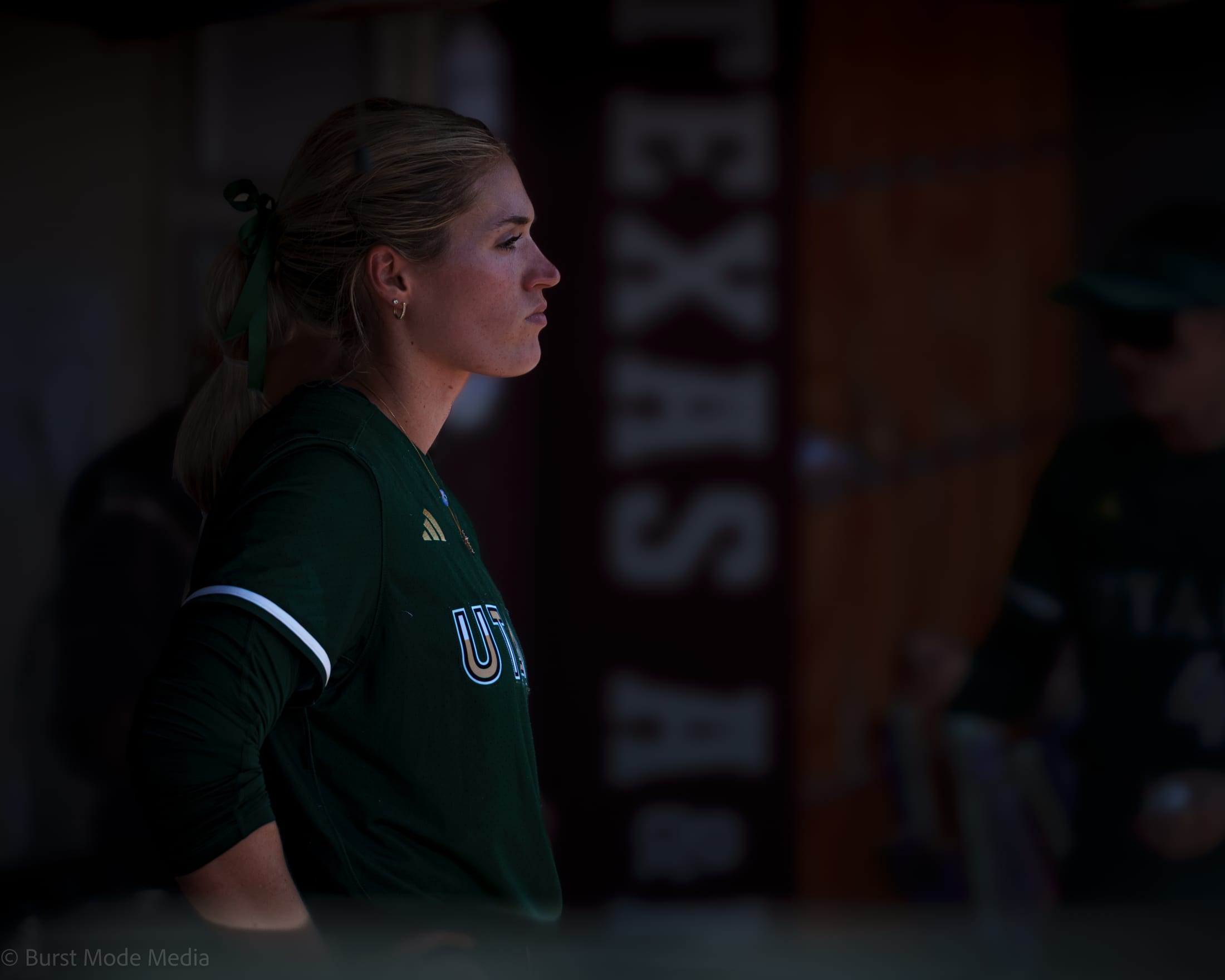 Montana Fouts focuses in the dugout during Game 2 at Davis Diamond.