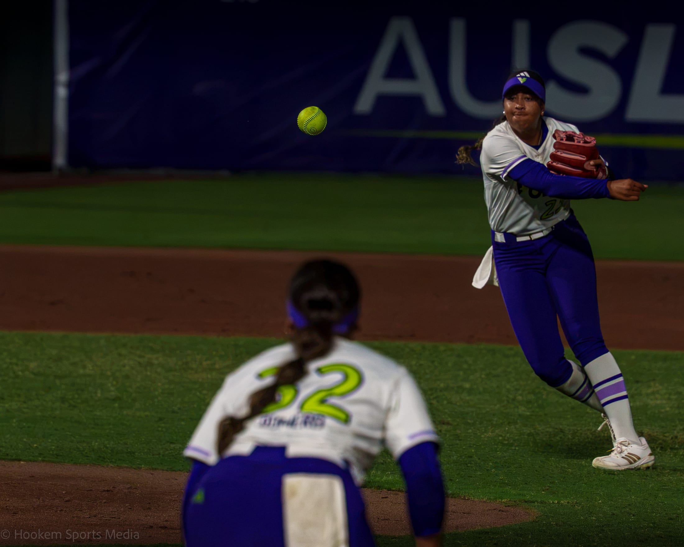 Tiare Jennings protects first with a throw from second to Romero.