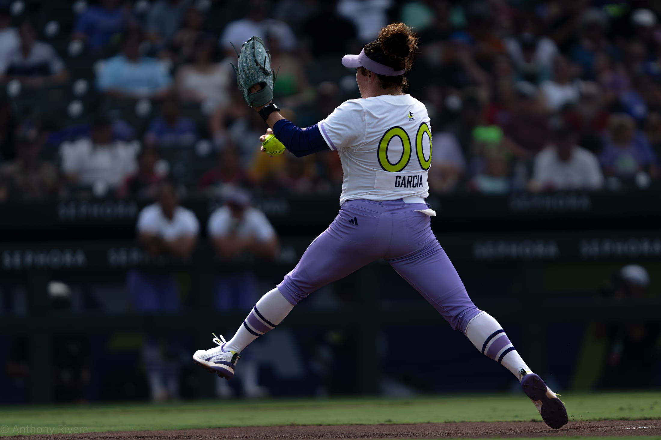 Texas Volts Pitcher Rachel Garcia leaps into her pitch.