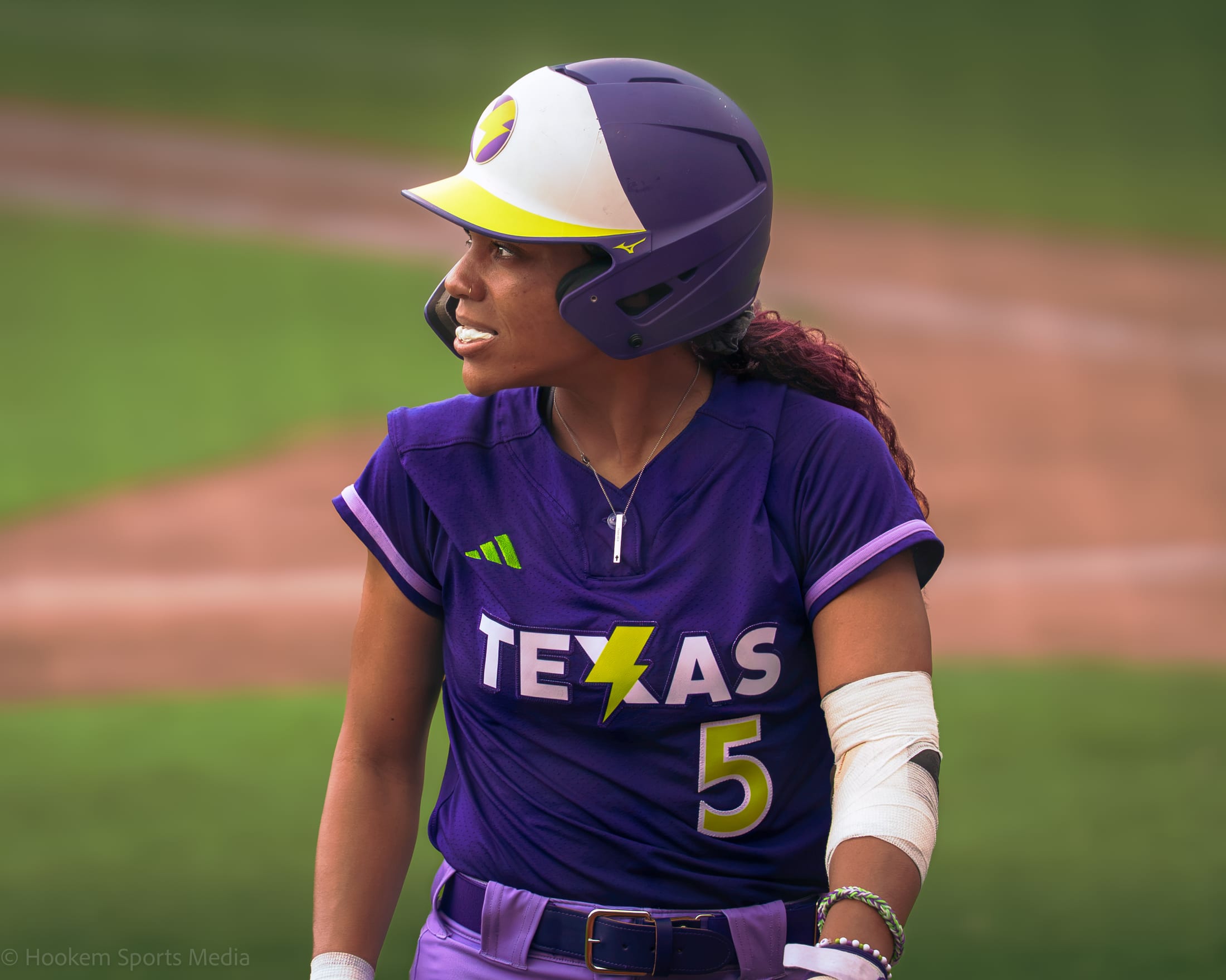 Rylie Boone returns to the dugout with a full cheek of gum at Dell Diamond.
