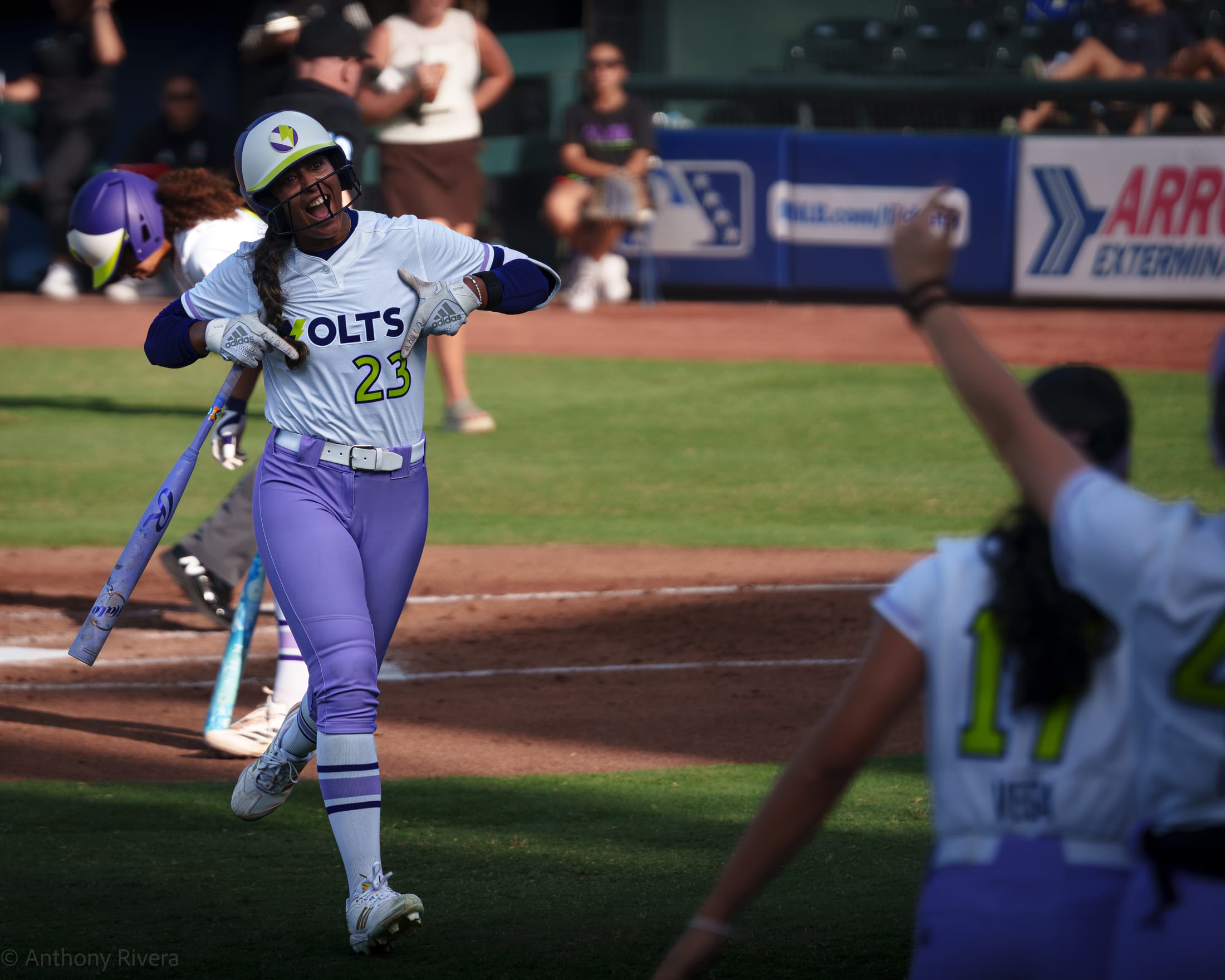 Tiare Jennings celebrated by the dugout after home run.
