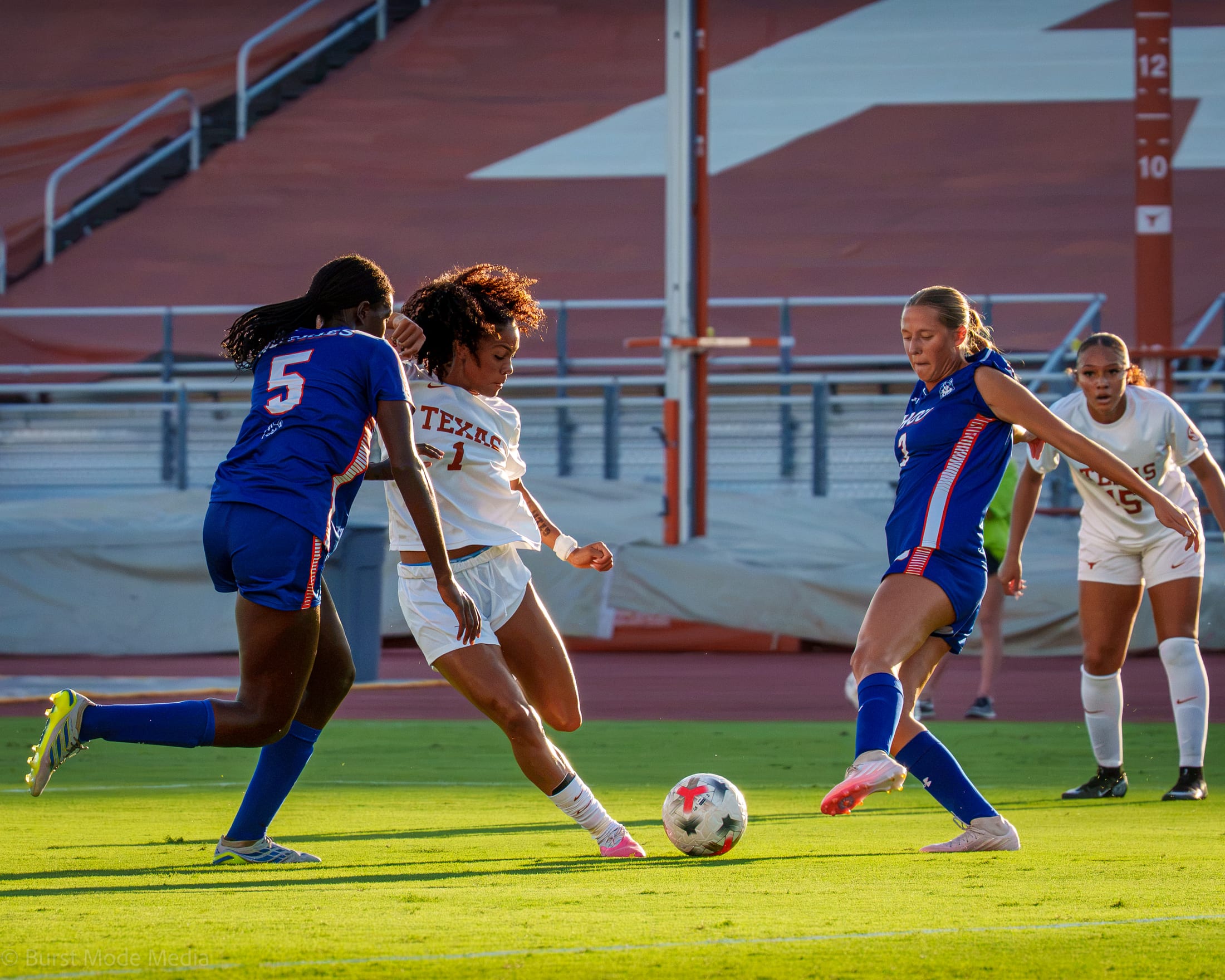 Texas Soccer forward Ava McDonald cuts through HCU defense.