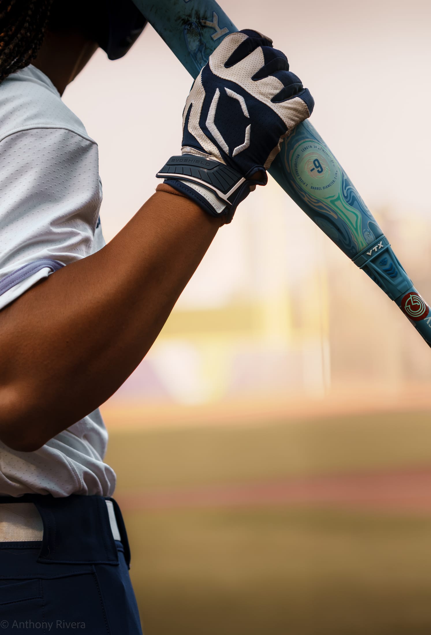 A Texas Volts player holding a bat on deck.