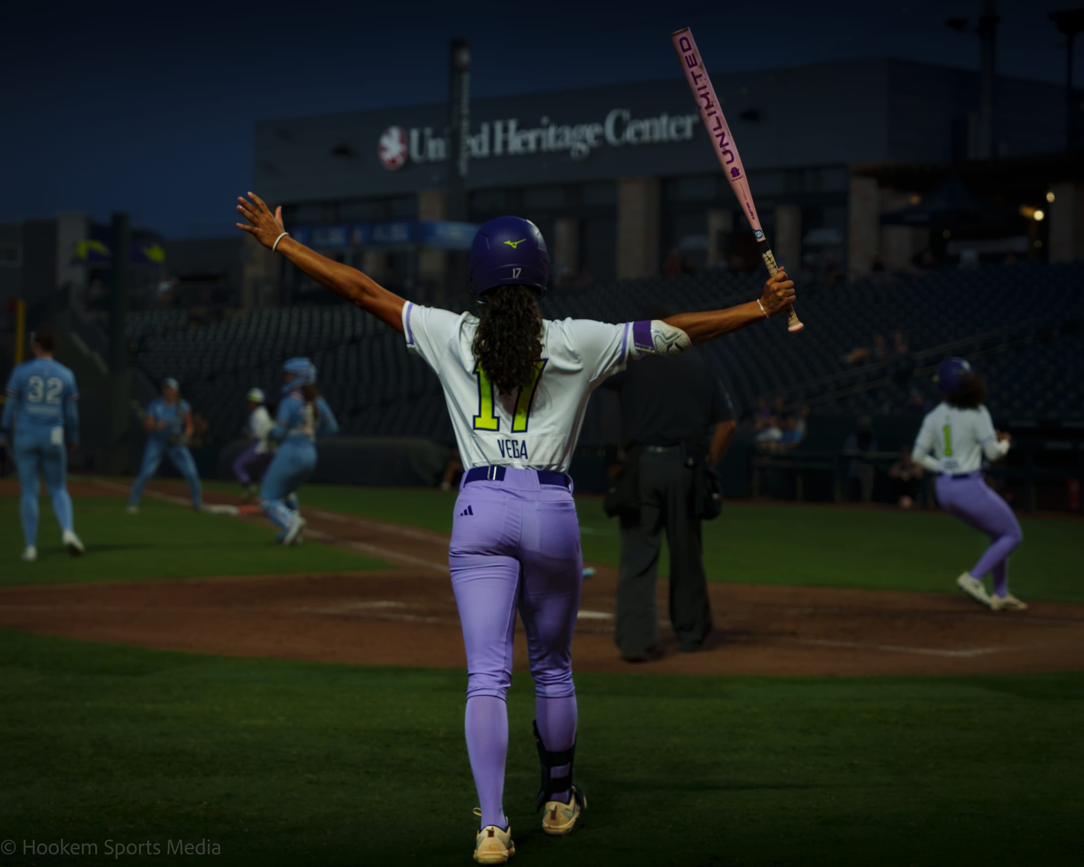 Vega celebrates from on deck as the Volts run in.