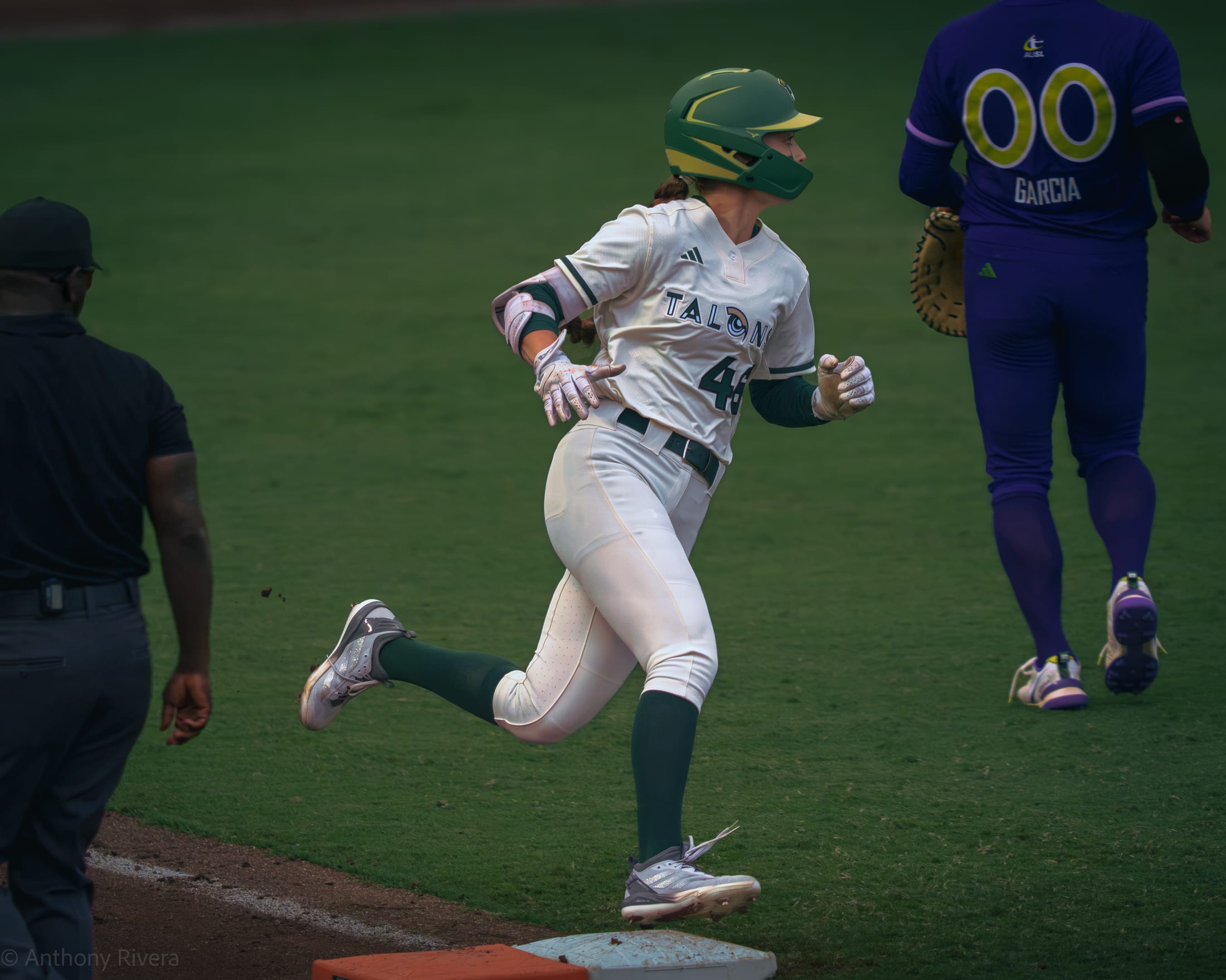 Kailey Wyckoff rounds first base on a home run at Dell Diamond.